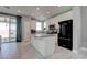 Bright kitchen featuring white cabinets, stainless steel appliances, and a large island at 1141 Cactus Rock St, Henderson, NV 89011
