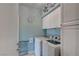 Functional laundry room with a washer, dryer, and ample storage space at 1141 Cactus Rock St, Henderson, NV 89011