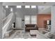 Well-lit living room with staircase, features high ceilings and a cozy seating arrangement at 1141 Cactus Rock St, Henderson, NV 89011