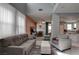 Open-concept living area with stylish furnishings, tile flooring, and bright natural light at 1141 Cactus Rock St, Henderson, NV 89011