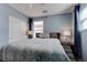 Main bedroom featuring a king bed, large windows, and ensuite bathroom at 1141 Cactus Rock St, Henderson, NV 89011