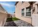 Cozy outdoor patio with pavers, artificial turf, and a privacy fence creating a private relaxation space at 1141 Cactus Rock St, Henderson, NV 89011