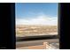 Scenic view of the desert landscape and distant mountains seen through a window at 1141 Cactus Rock St, Henderson, NV 89011
