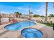 Spectacular backyard with a pool, hot tub, waterfall feature, and lush landscaping at 1229 Swanbrooke Dr, Las Vegas, NV 89144