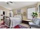 Cozy bedroom with floral bedding, vintage furniture, and natural light at 1229 Swanbrooke Dr, Las Vegas, NV 89144