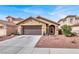 Charming single-story home with a well-maintained front yard and a two-car garage at 1229 Swanbrooke Dr, Las Vegas, NV 89144
