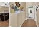 Inviting hallway with wooden floors and decor with doorway visible to an adjacent room at 1229 Swanbrooke Dr, Las Vegas, NV 89144