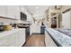 Bright and modern kitchen with white cabinets, stainless steel appliances, and a center island at 1229 Swanbrooke Dr, Las Vegas, NV 89144
