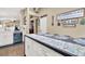 Bright kitchen with white cabinets, a center island, stainless steel appliances, and modern decor at 1229 Swanbrooke Dr, Las Vegas, NV 89144