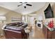 Spacious living room featuring wood laminate floors, a fireplace, and an inviting ambiance at 1229 Swanbrooke Dr, Las Vegas, NV 89144