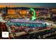 Expansive nighttime aerial view of the Formula 1 Paddock and main grandstands at 125 E Harmon Ave # 2318, Las Vegas, NV 89109