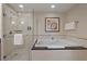 Bathroom showcasing standalone shower, soaking tub, and chrome hardware at 125 E Harmon Ave # 2318, Las Vegas, NV 89109