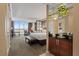 Bright bedroom featuring city views, seating area, modern furnishings, and comfortable king bed at 125 E Harmon Ave # 2318, Las Vegas, NV 89109