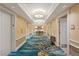 Hallway with patterned carpet, decorative lighting and elevator access to floors at 125 E Harmon Ave # 2318, Las Vegas, NV 89109