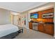 Bedroom view showcasing kitchenette area, and mounted television at 125 E Harmon Ave # 2318, Las Vegas, NV 89109