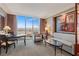 Living room with large picture window overlooking the city view and plush seating at 125 E Harmon Ave # 2318, Las Vegas, NV 89109