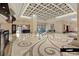 Spacious lobby with decorative tile flooring, column and seating area at 125 E Harmon Ave # 2318, Las Vegas, NV 89109
