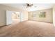 Large bedroom features ceiling fan, carpet, and multiple windows at 1307 Bayleaf Terrace Ave, Henderson, NV 89014