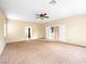 A large bedroom with a ceiling fan and carpet at 1307 Bayleaf Terrace Ave, Henderson, NV 89014