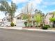 Charming two-story home boasts a well-manicured lawn, mature trees, and a spacious two-car garage at 1307 Bayleaf Terrace Ave, Henderson, NV 89014