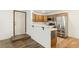 Kitchen featuring wood cabinets, tile backsplash, stainless steel appliances, and breakfast bar at 1404 Santa Margarita St # D, Las Vegas, NV 89146