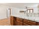 Kitchen sink and counter area with a view into the living space with a fireplace at 1404 Santa Margarita St # D, Las Vegas, NV 89146