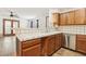 Open concept kitchen, featuring tile countertops, and stainless steel appliances at 1404 Santa Margarita St # D, Las Vegas, NV 89146