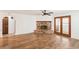 Bright living room featuring wood floors, fireplace, and ceiling fan at 1404 Santa Margarita St # D, Las Vegas, NV 89146