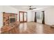 Spacious living room with wood floors, fireplace, ceiling fan and back patio access at 1404 Santa Margarita St # D, Las Vegas, NV 89146