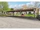 Condos with covered parking, landscaped grounds, and stairs leading to each unit at 1404 Santa Margarita St # D, Las Vegas, NV 89146