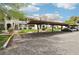 Condos with covered parking, landscaped grounds, and stairs leading to each unit at 1404 Santa Margarita St # D, Las Vegas, NV 89146