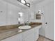 Well-lit bathroom featuring built-in cabinets and a large mirror over the vanity at 1440 Vegas Valley Dr # 1, Las Vegas, NV 89169