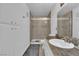 Bright bathroom featuring a walk-in shower with glass doors and a marble countertop at 1440 Vegas Valley Dr # 1, Las Vegas, NV 89169