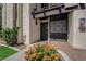 Inviting front entrance with a black security door and well-maintained landscaping and stucco at 1440 Vegas Valley Dr # 1, Las Vegas, NV 89169