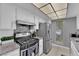 Well-lit kitchen featuring stainless steel appliances, granite countertops, and stylish backsplash at 1440 Vegas Valley Dr # 1, Las Vegas, NV 89169
