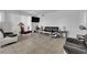 The living room features tile floors, large windows, modern furniture, and a sleek entertainment setup at 1440 Vegas Valley Dr # 1, Las Vegas, NV 89169