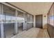 An outdoor living space featuring a tiled floor, sliding glass doors, and secure iron bars overlooking a city view at 1440 Vegas Valley Dr # 14, Las Vegas, NV 89169