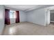 Bright bedroom features tile flooring, light blue walls, window and view at 1440 Vegas Valley Dr # 14, Las Vegas, NV 89169