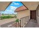 Charming entryway with a tiled roof, secure railing, and a sturdy front door and well kept landscaping at 1440 Vegas Valley Dr # 14, Las Vegas, NV 89169