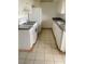 Compact kitchen with white appliances, granite countertops, and ample cabinet space, ensuring functionality at 1440 Vegas Valley Dr # 14, Las Vegas, NV 89169