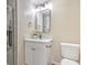 Bathroom vanity with modern fixtures and a decorative mirror and a glass shower door at 1911 Jarvis Rd, Pahrump, NV 89060