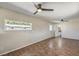 Bedroom with tile floors, two ceiling fans, and large windows offers lots of space and light at 1911 Jarvis Rd, Pahrump, NV 89060