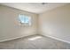 Bedroom with neutral walls, plush carpeting, and a window for natural light at 1911 Jarvis Rd, Pahrump, NV 89060