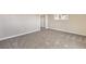 Bedroom with neutral carpet and closet with bi-fold doors at 1911 Jarvis Rd, Pahrump, NV 89060