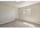 Bedroom featuring neutral walls, carpet floors, and a view outside the window at 1911 Jarvis Rd, Pahrump, NV 89060