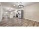 Open dining area featuring a chandelier, stainless steel appliances, and an open floorplan at 1911 Jarvis Rd, Pahrump, NV 89060
