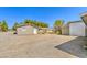 View of the home exterior with driveway and a detached garage at 1911 Jarvis Rd, Pahrump, NV 89060