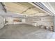 Spacious garage features an automatic door, ample storage, and a workbench area for projects at 1911 Jarvis Rd, Pahrump, NV 89060
