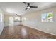 Spacious living room with tile floors, natural light, and an open doorway to the kitchen area at 1911 Jarvis Rd, Pahrump, NV 89060
