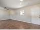 Open living room showcases tile floors, a ceiling fan, and a bright window for natural light at 1911 Jarvis Rd, Pahrump, NV 89060